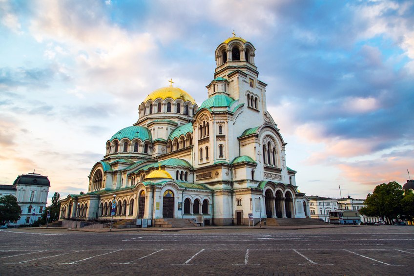 St. Alexander Nevsky Cathedral in the center of Sofia, capital of Bulgaria against the blue morning sky with colorful clouds