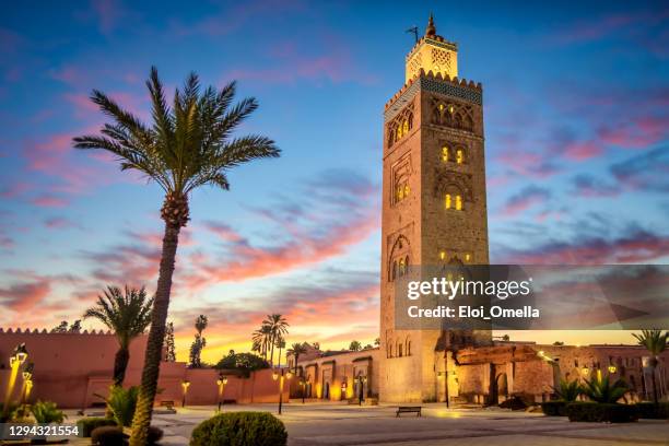 Koutoubia mosque in the morning surrounded by palm tree, Marrakesh, Morocco